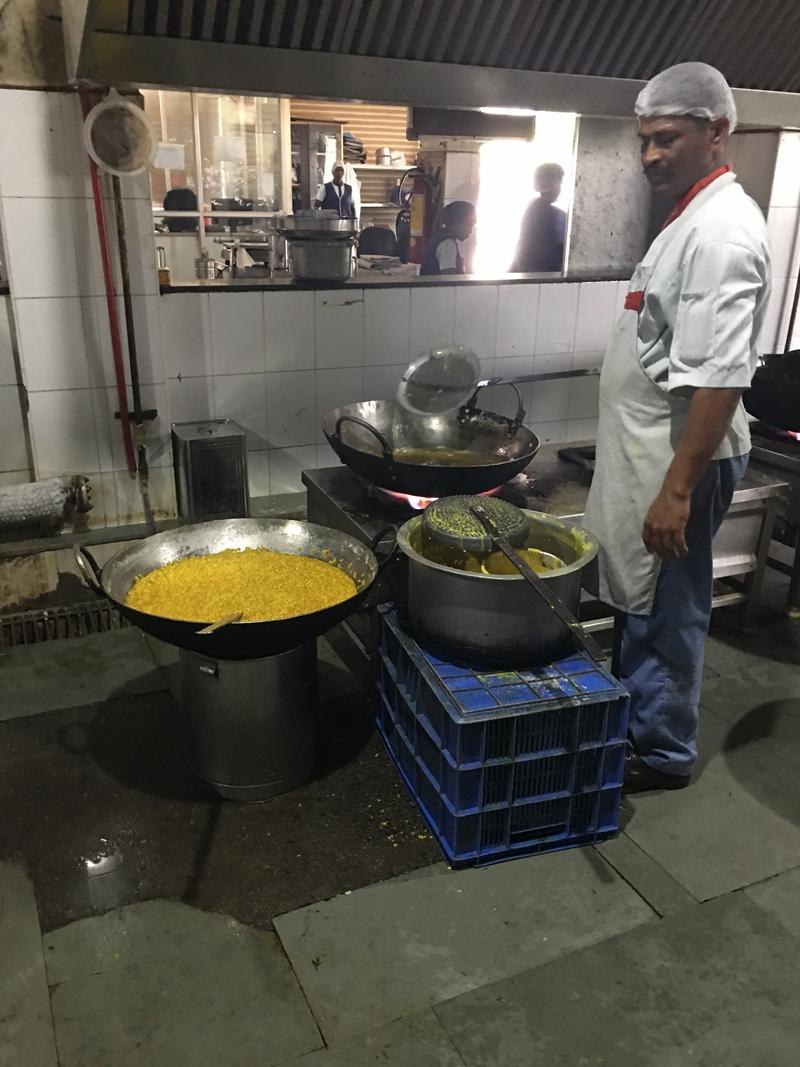 Cooking a large batch of Indian food at Eco Kitchen, Chennai, Tamil Nadu, India