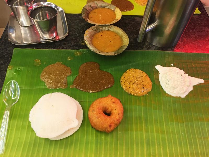 Idly, vada, sambar and chutney selection served on a banana leaf at Murugan Idly Shop, Chennai. Tamil Nadu, India