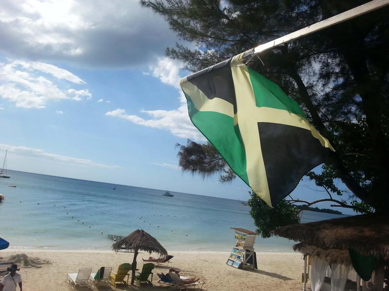 Jamaican flag at the beach, Negril, Jamaica