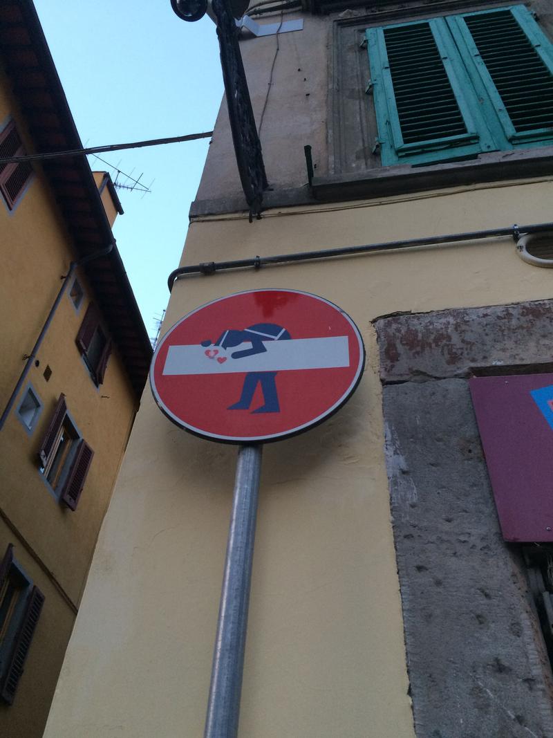 Creative street signage: love drunk policeman, Florence, Italy