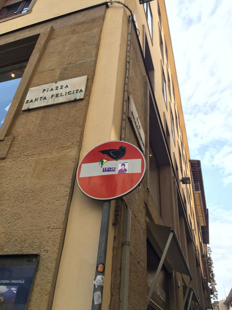 Creative street signage: the bird shit, Florence, Italy