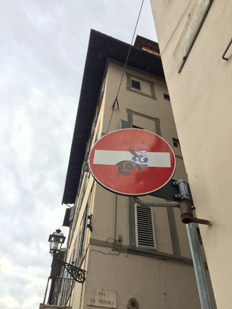 Creative street signage: the beating, Florence, Italy