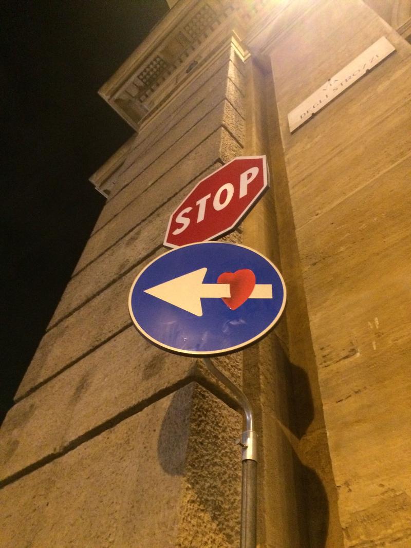 Creative street signage: shot through the heart, Florence, Italy