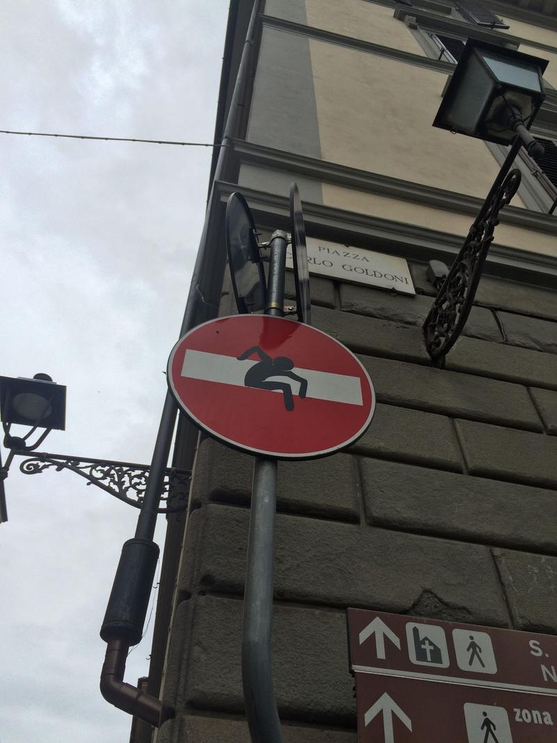 Creative street signage: climbing out, Florence, Italy