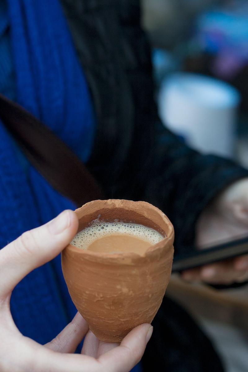 Enjoying some chai in a single-use pottery cup, Agra, Uttar Pradesh, India