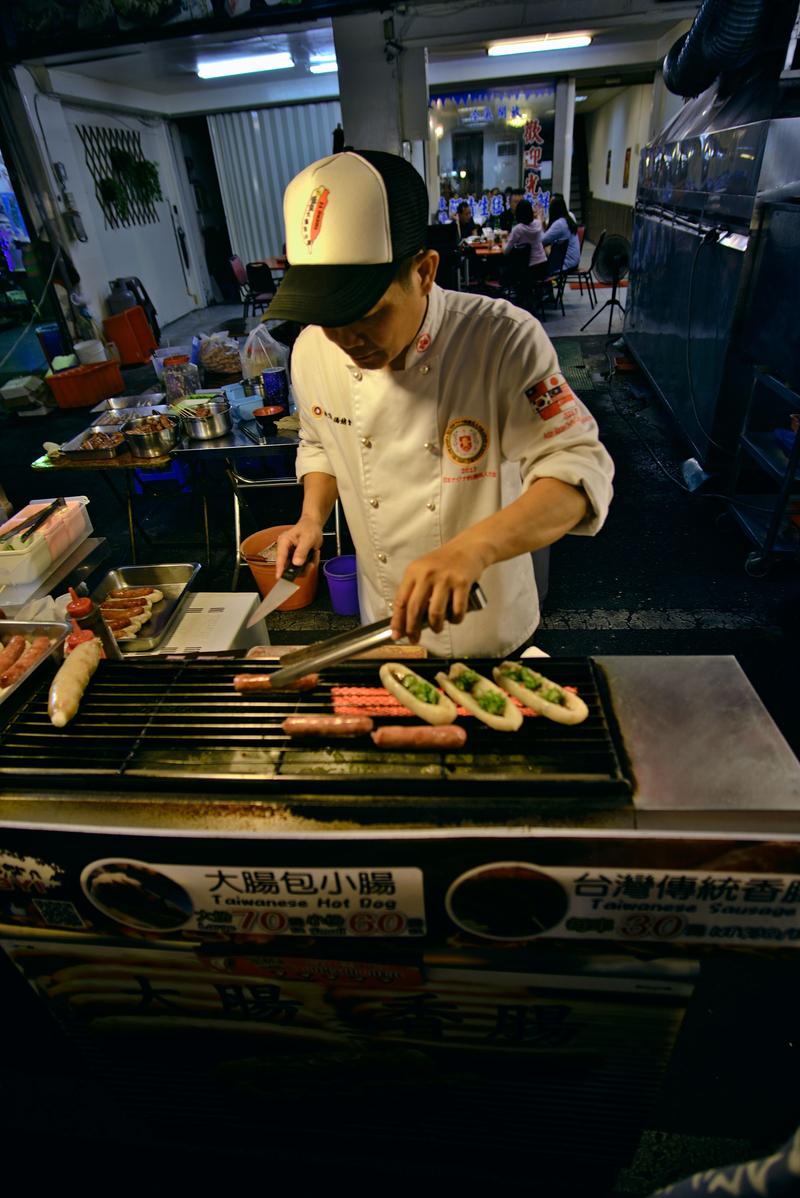 Taiwanese hot dog vendor at Liuhe Night Market, Kaosiung, Taiwan