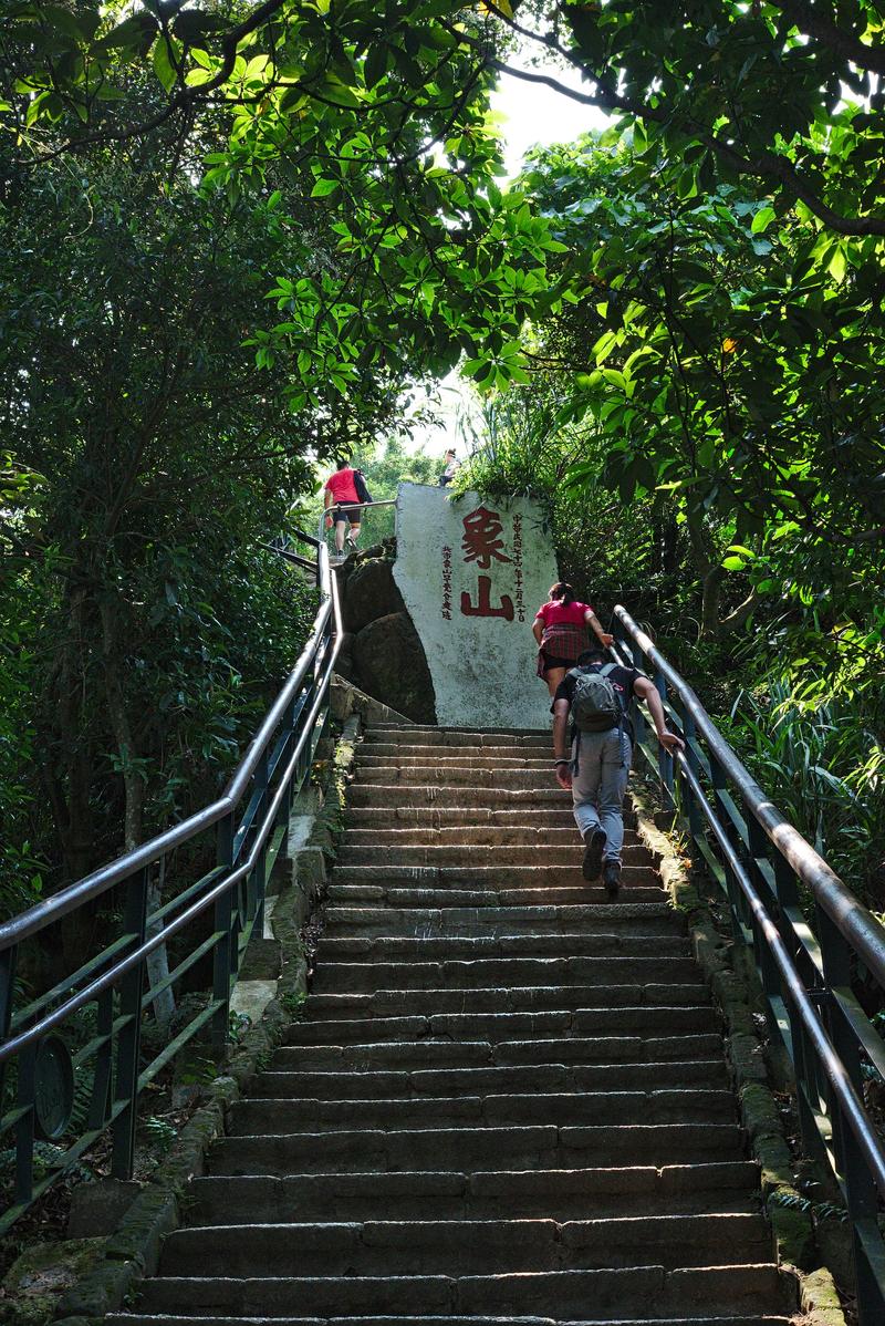 Climbing Elephant mountain’s stairs to the next viewing platform