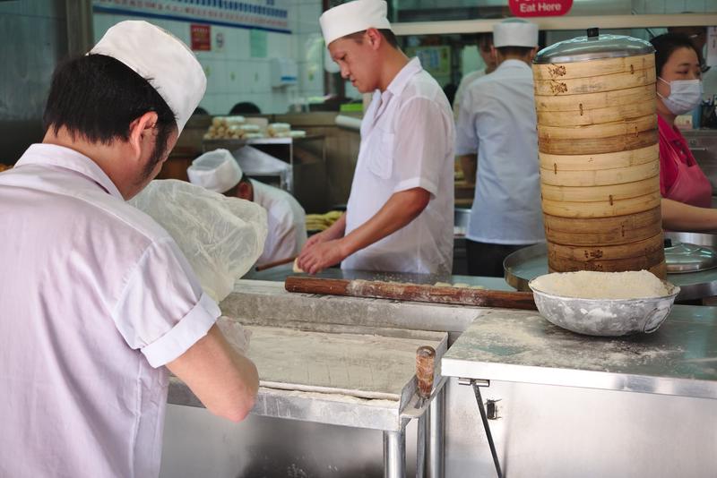 Rolling out and frying dough. Yong He Soy Milk King – Taipei, Taiwan.