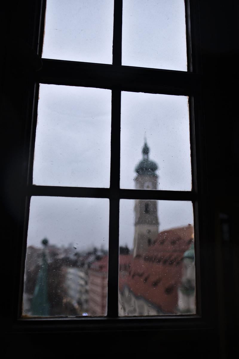 Rathaus-Glockenspiel in Marienplatz viewed through a window in the Spielzeugmuseum (old town hall toy museum), Munich, Germany
