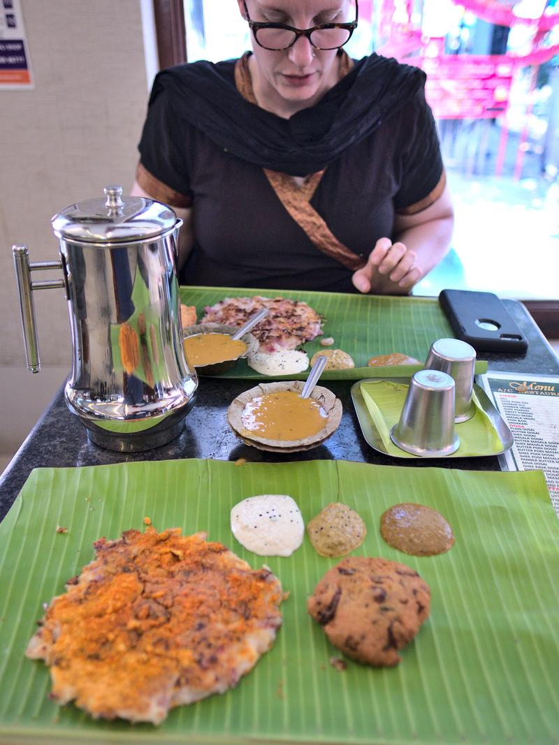 Our first meal had to be at our favorite Chennai eatery: Murugan Idli Shop. Pictured here is a onion uppatham (top), podi onion uppatham & vada (bottom) with a smearing of all the chutneys. Chennai, Tamil Nadu, India