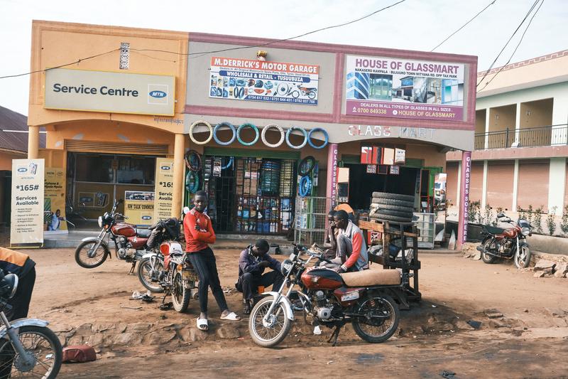 People hanging out in front of stores, Uganda