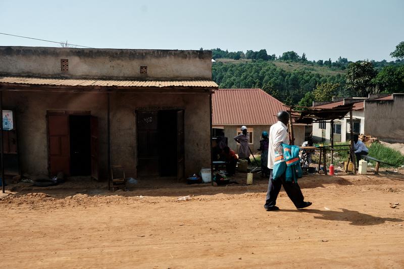 People hanging out in front of homes, Entebbe, Uganda