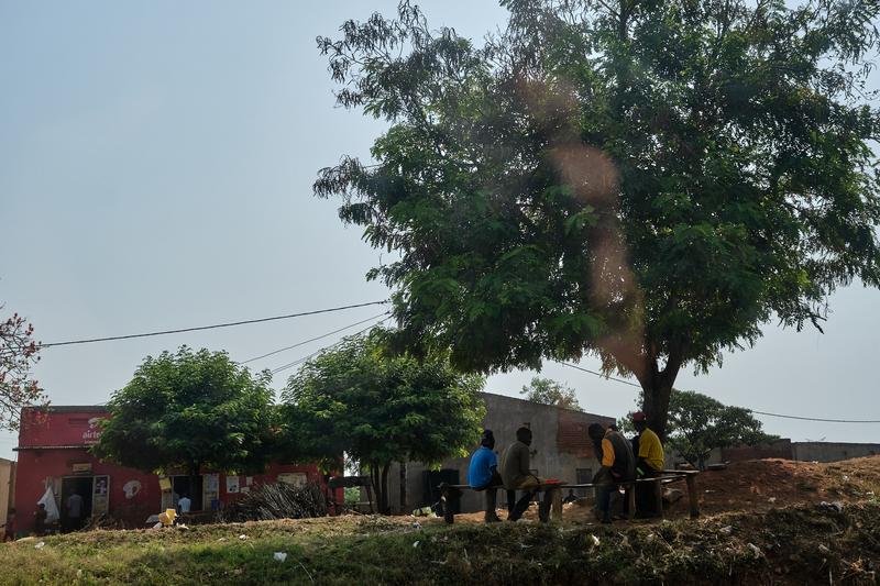 People hanging out under trees, Uganda